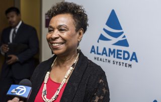 Barbara Lee speaks at Highland Hospital.